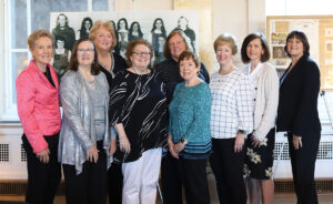 Women pose at 50th reunion event