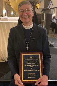 Nun holds award