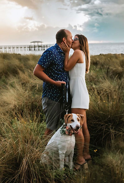 Engagement photo of man and woman kissing