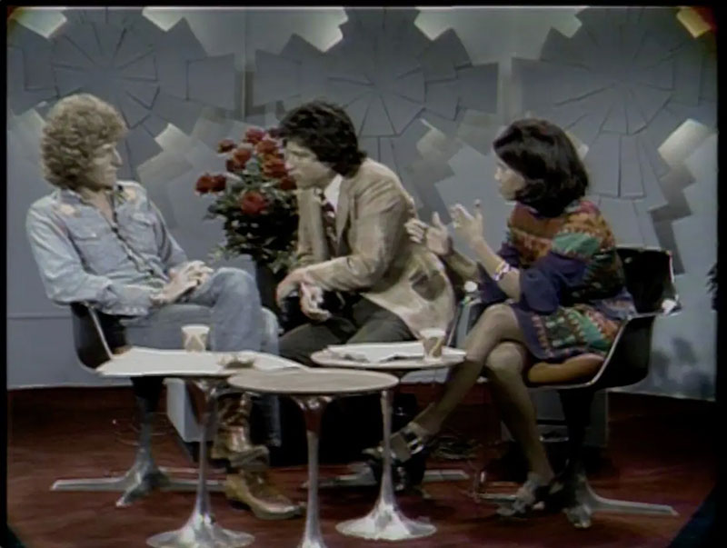 Two men and a woman on TV talk show