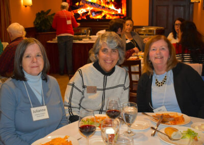 Three women at dinner table