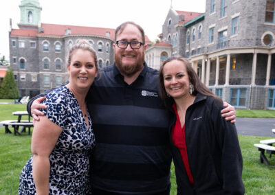 Three people on college campus