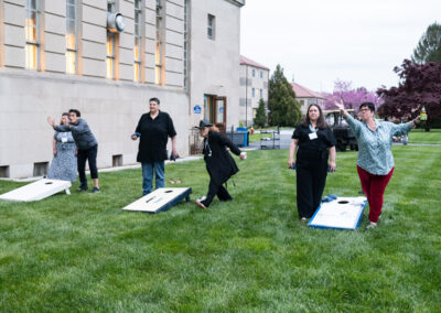 People playing cornhole