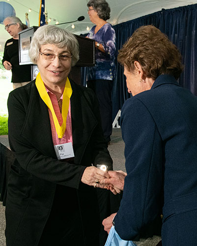 Women accepting award