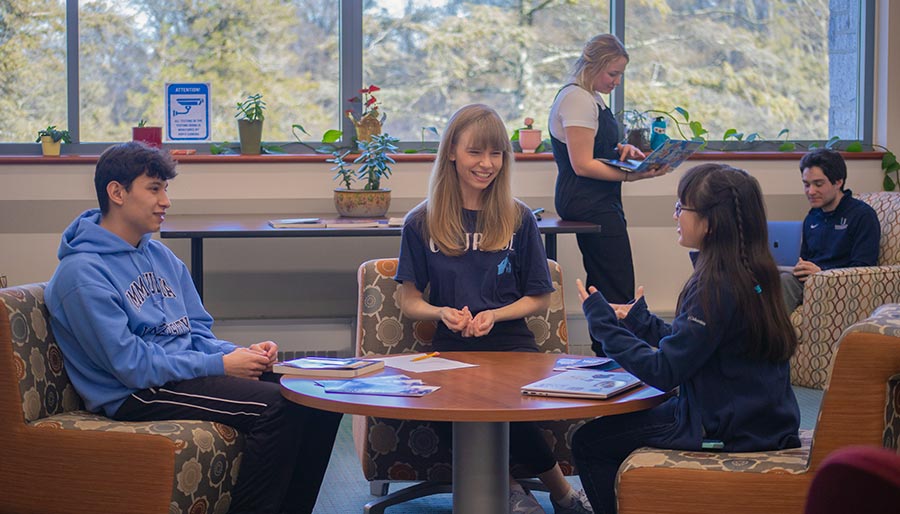 Students sitting around a table