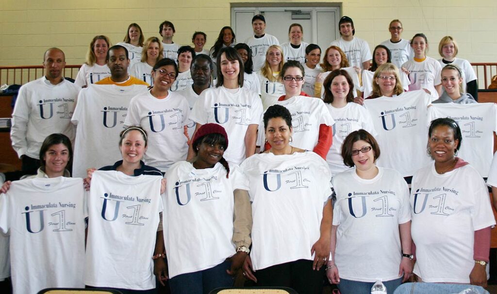 Group of students with shirts that say "Immaculata Nursing First Class"