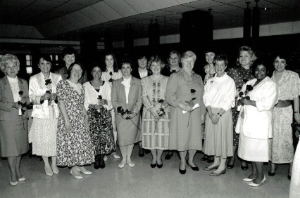 Black and white photo of group of women