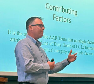 Man in front of screen in classroom