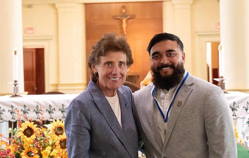 Man and woman in front of altar in chapel