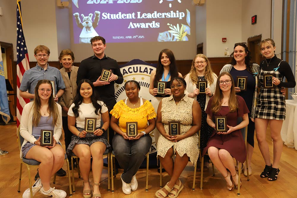 Group of people holding awards