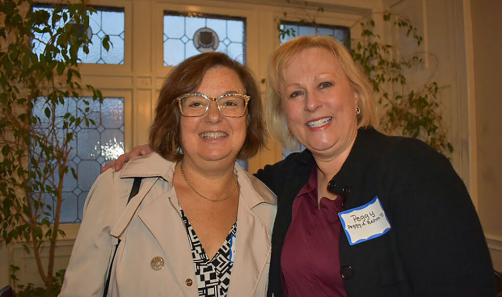 Two women smiling for camera