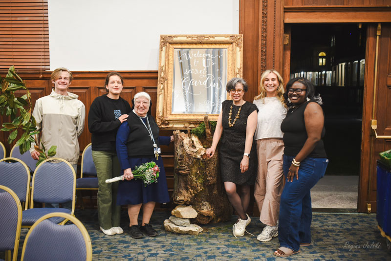Nun and faculty member with four college students